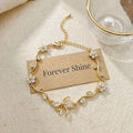 Floral Bow Bracelet – Crystal Flower & Bow Charm Gold Chain