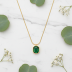 Emerald Necklace on Marble with Flowers